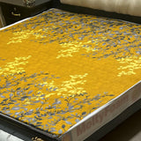 Printed waterproof mattress cover in golden yellow